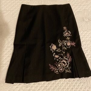 Skirt with kick pleats